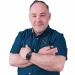 A man with his arms crossed and wearing a watch.